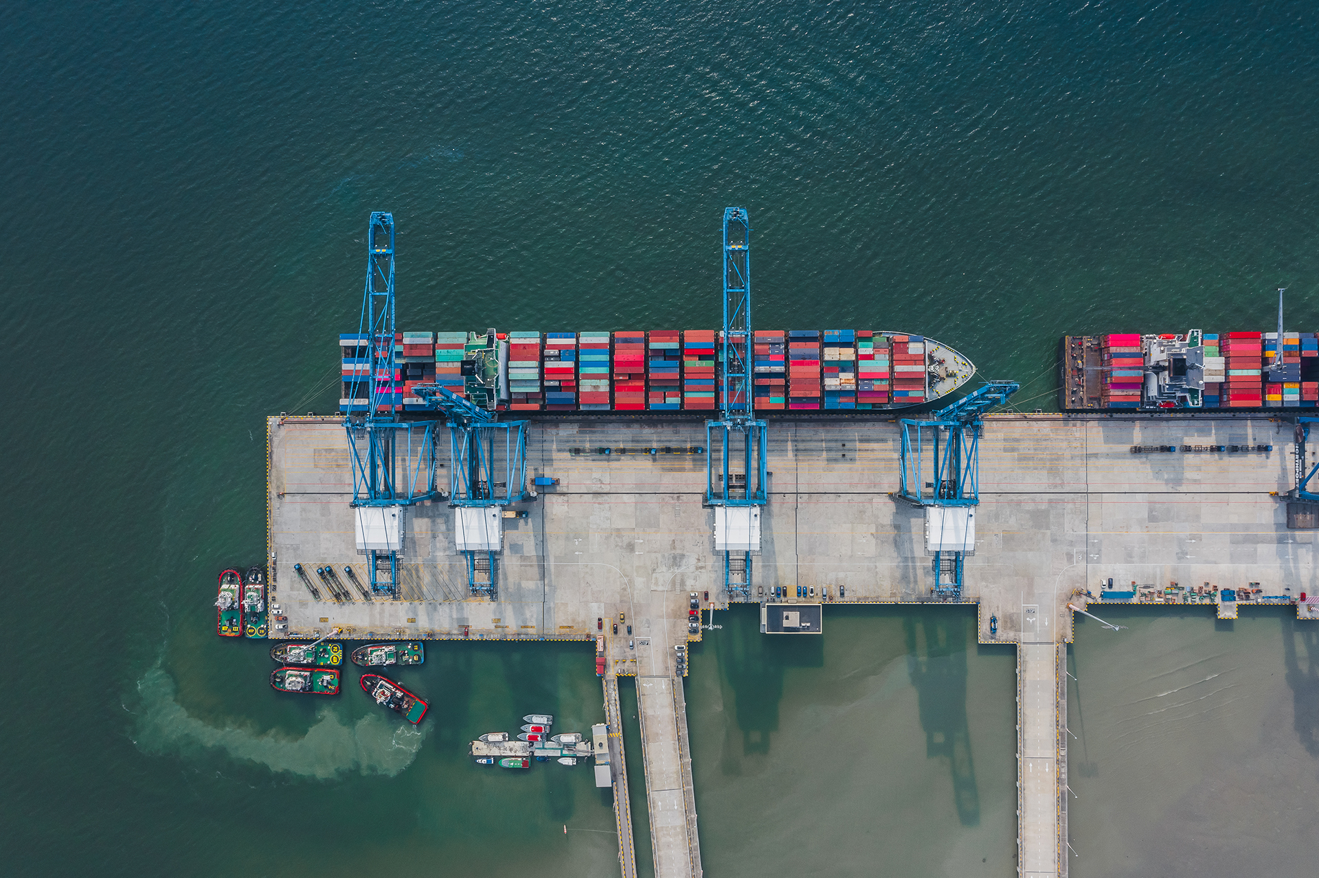 Aerial view of a cargo ship almost ready to carry and transport huge containers through the sea A aerial view of a cargo ship almost ready to carry and transport huge containers through the sea