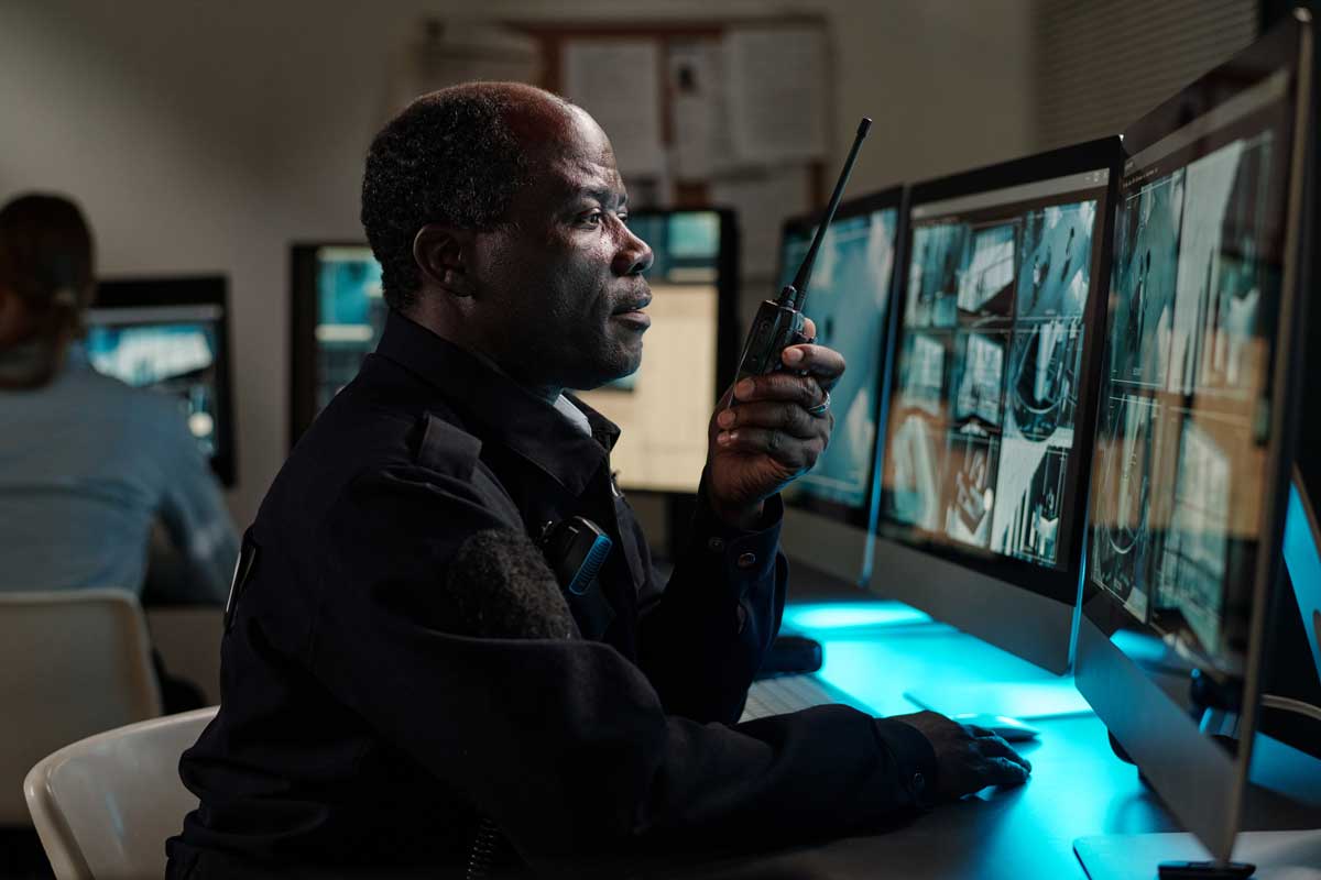Security Guard Monitors Multiple Remote Locations Virtually In Real Time