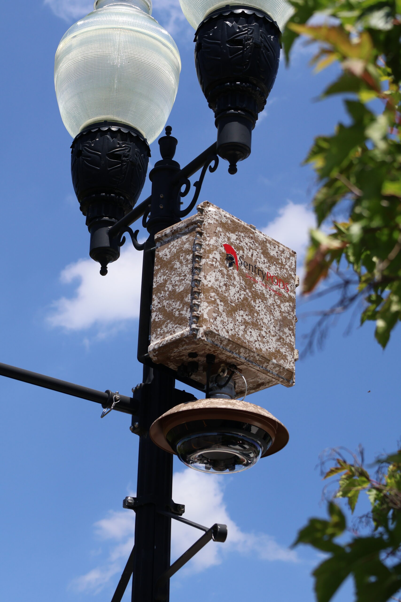 A SentryPODS surveillance unit deployed on a streetlight
