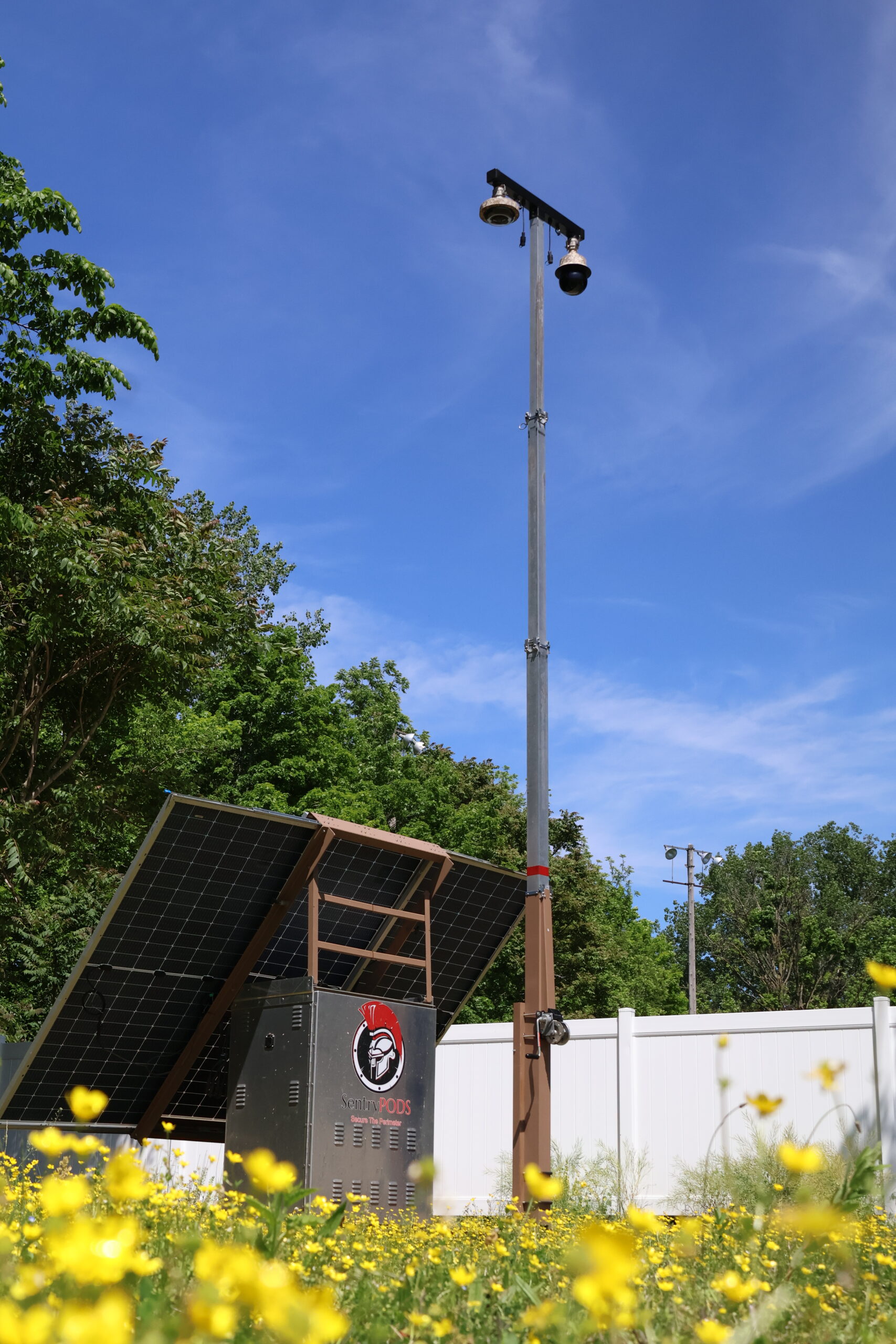 Spartan solar surveillance skid deployed in the field with its mast fully extended