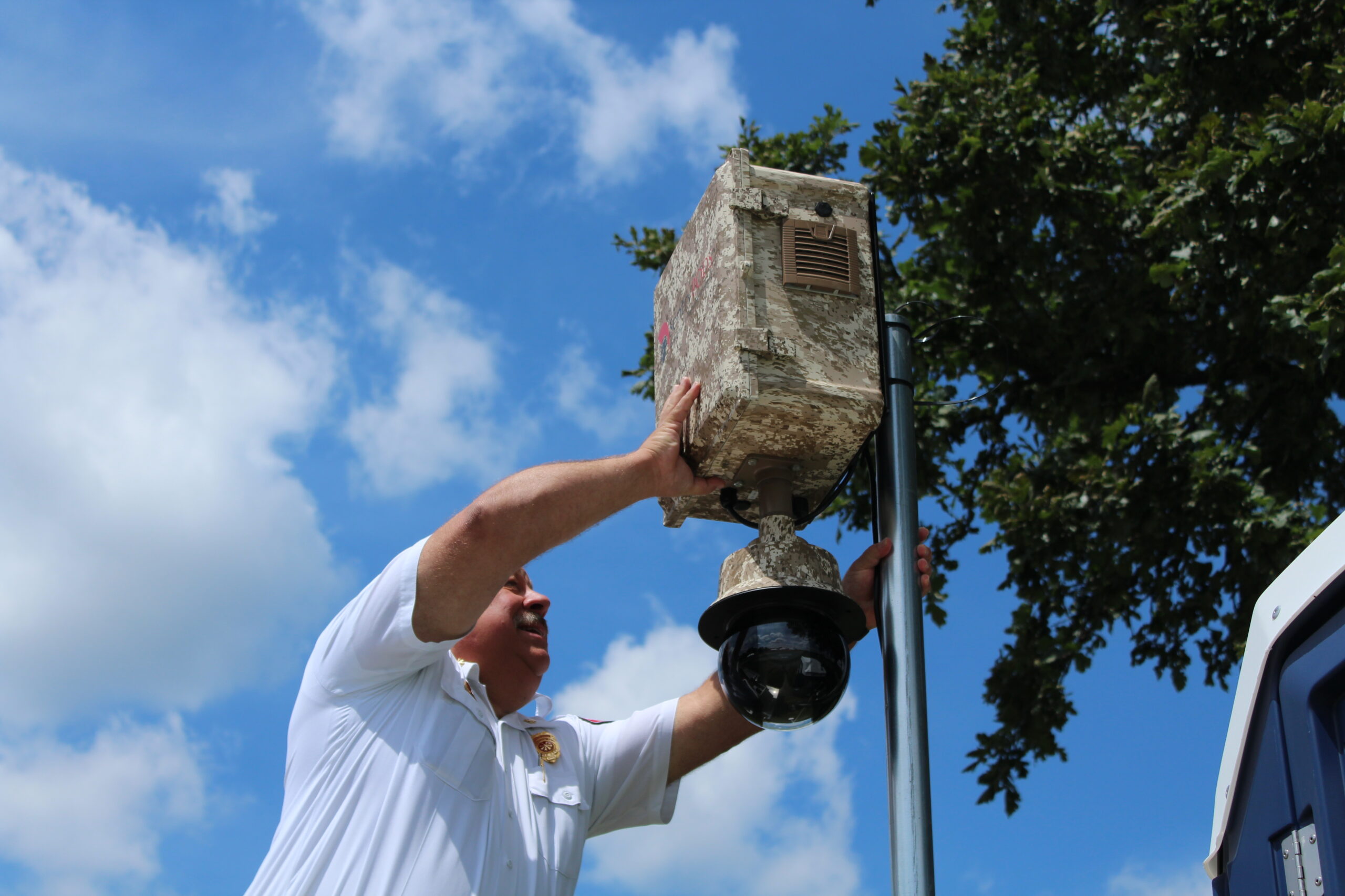 Technician installing a Hunter surveillance unit at the Kent Balloon Festival