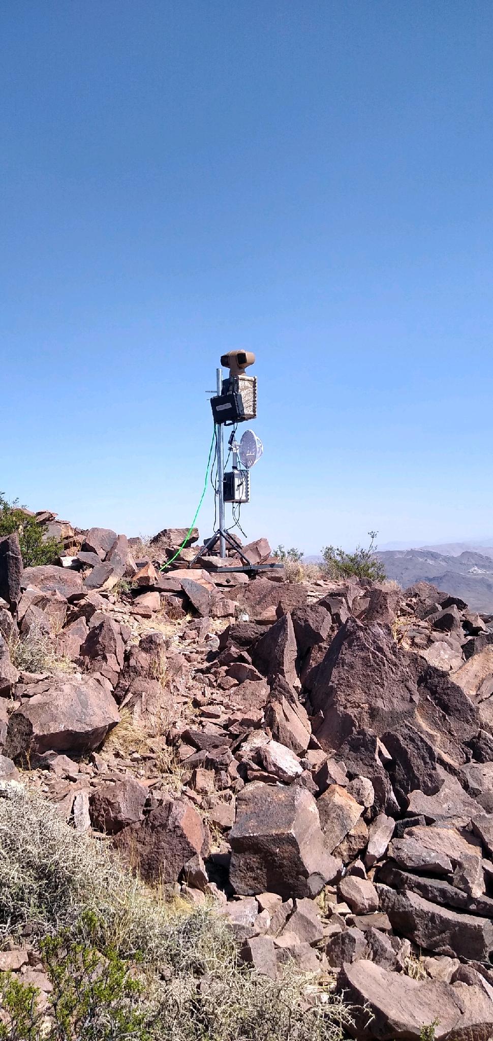 SentryPODS Recon surveillance unit deployed at a military base in a desert environment